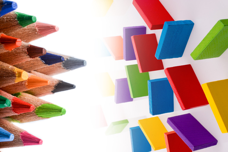 Color pencils of various color and colorful domino piecesの写真素材
