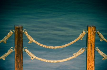Part of a fence made of wood in viewの写真素材