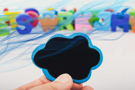 Speech bubble icon in hand as communication concept