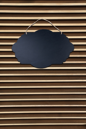 Black Empty Sign Board with string for hanging on wallの写真素材