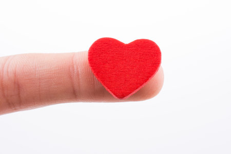 Hand holding a red heart