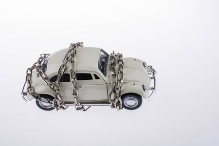 Chained white car on white backgroundの写真素材