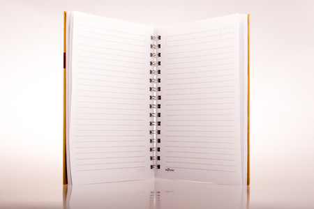 Spiral notebook on a white backgroundの写真素材