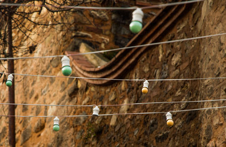 Light bulbs are hanging on a fixed placeの写真素材
