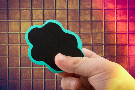 Speech bubble icon in hand as communication conceptの写真素材