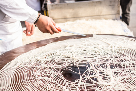 The making of Turkish desert Kadayif pastry in displayの写真素材