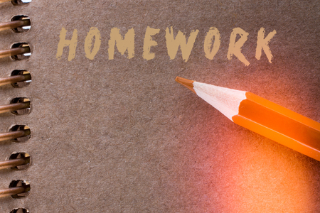 Hand holding a sheet of paper on a whiteの写真素材