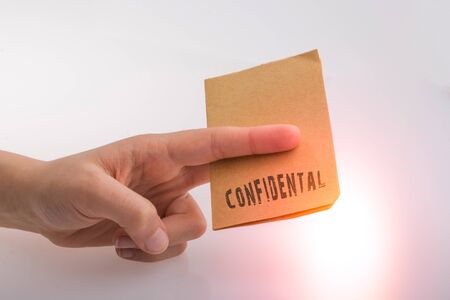 Brown paper  text confidental on a white backgroundの写真素材