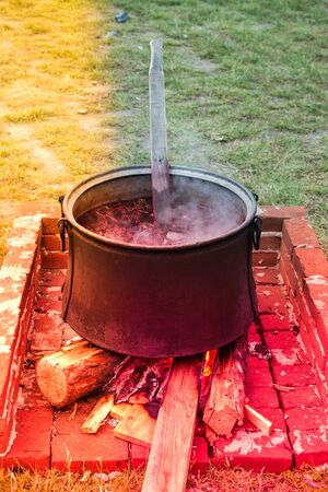 Retro style old metal cauldron  item for cookingの写真素材