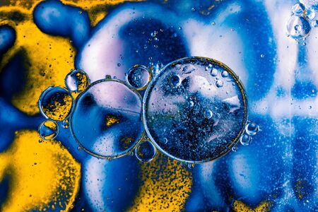 Oil bubbles inside water base form patternsの写真素材