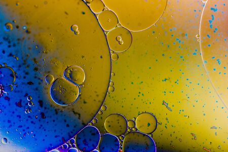 Oil bubbles inside water base form patternsの写真素材