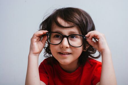 Little cute boy with glasses and happy smileの写真素材