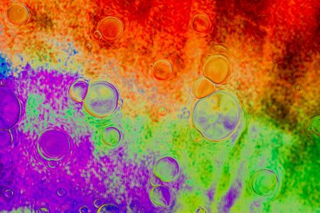 Air and oil bubbles inside water base form patternsの写真素材