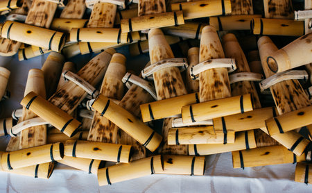 Dozens of handmade bamboo flutes in the view