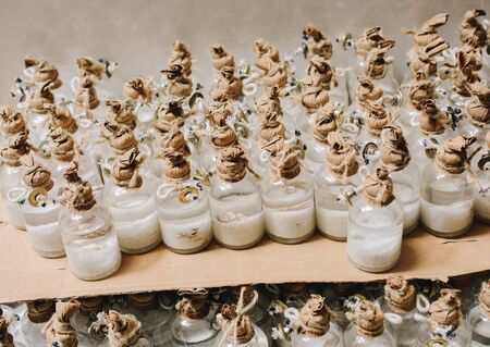 Plenty of little colorful decorative bottles on shelfの写真素材