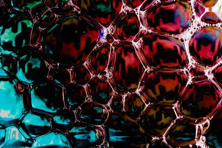 Oil bubbles inside water base form patternsの写真素材