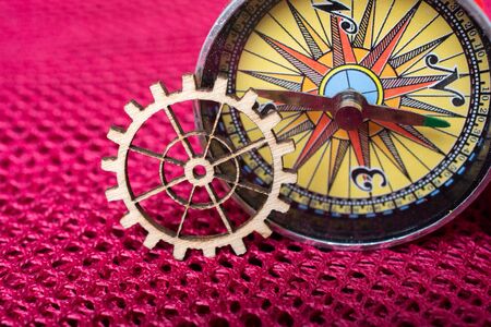Gear wheel and a compass as The concept of mechanismの写真素材