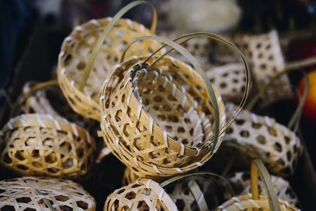 Empty wicker baskets are for sale in a market placeの写真素材