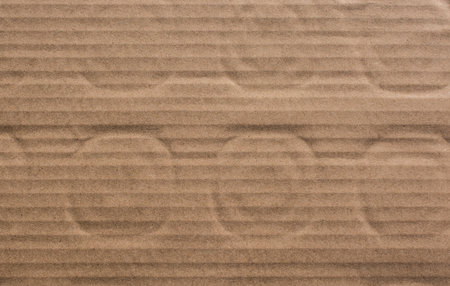 Cardboard texture  with round patterns on it in the view