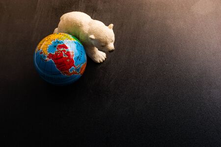 Polar bear model and a globe model in viewの写真素材