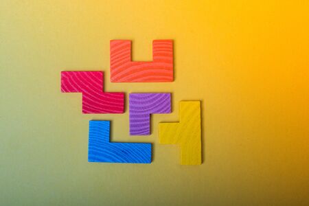 Piece of wooden colorful  puzzle as problem solving conceptの写真素材