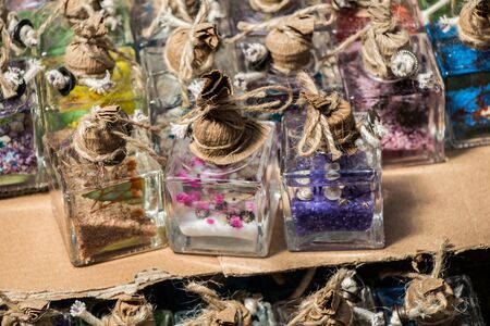 Plenty of little colorful decorative bottles on shelfの写真素材