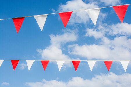 Colorful triangle bunting flags of various colors as festival concepの写真素材