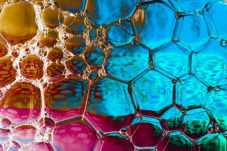 Oil bubbles inside water base form patternsの写真素材