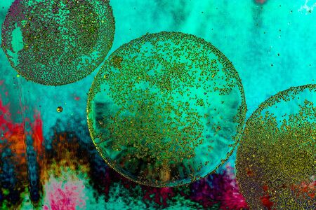 Air and oil bubbles inside water base form patternsの写真素材