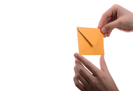 hand holding a red envelope on a white backgroundの写真素材