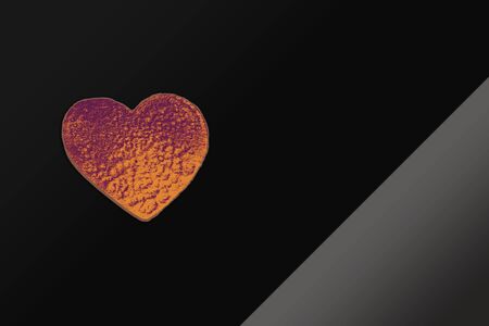 Heart shaped object amid pencil shavingsの写真素材