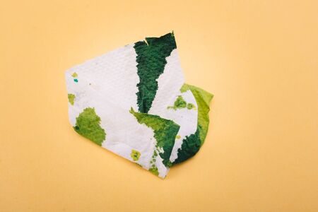 Stained tissue after wiped the green paint offの写真素材