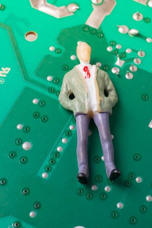 Tiny figurine of men model  on Circuit board of electronicsの写真素材