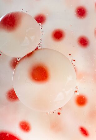 Oil bubbles inside water base form patternsの写真素材