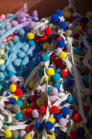 Collection of  fluffy pompons. The concept of touch, tactility, feelings.の写真素材