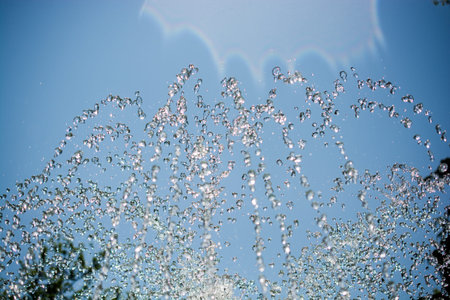 The fountains gushing sparkling water in a pool in a park