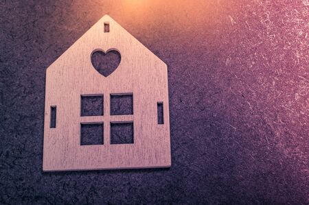 Wooden house shape with a  window as business conceptの写真素材