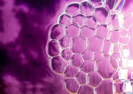 Oil bubbles inside water base form patternsの写真素材