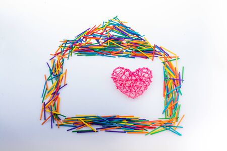 Heart and House shape  made with colorful sticks as creative conceptの写真素材