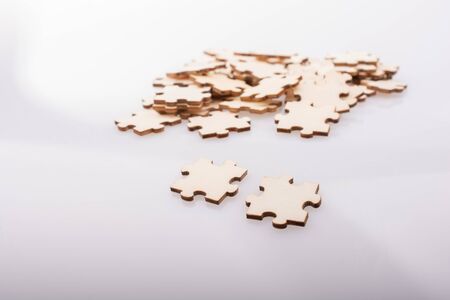 Pieces of jigsaw puzzle as problem solution concept on white backgroundの写真素材