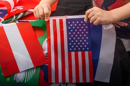 Child hand holding an American national flag in handの写真素材