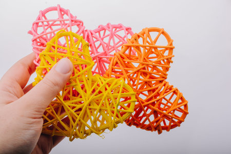 Handmade straw heart or valentines day object in hand