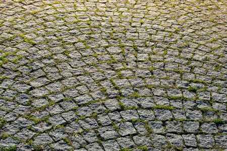 Cobblestone stone pavement background texture on the streetの写真素材