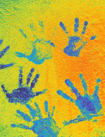 Color background of children's handprints. Multi colored hand prints.の写真素材