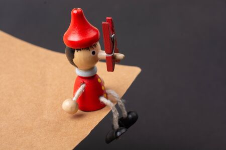 Colorful wooden pinocchio doll with his long noseの写真素材