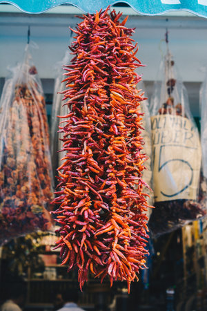 A Lot of hanging dried Red Chilli Peppers as background