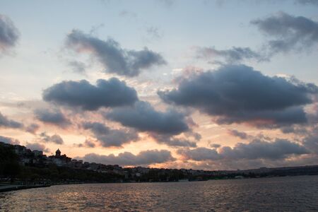 Grey color clouds partly cover the sky in the daytimeの写真素材