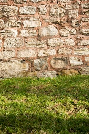 Wall made of the same type and same color of stonesの写真素材