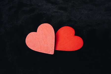 Red heart shaped on black color for love card and valentine day conceptの写真素材