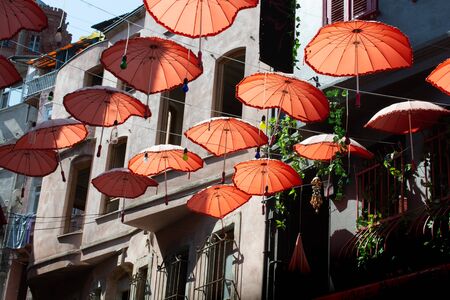 Rows Umbrellas floating above the street protecting from Sunlightの写真素材